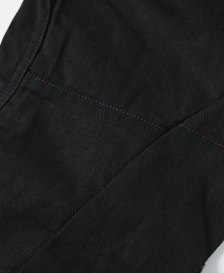 Black riding breeches interior seam with stitched panel at thigh