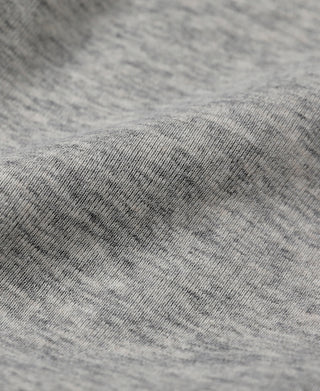 Gray heather knit fabric close-up with subtle speckled texture
