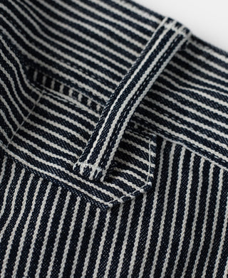 Striped carpenter pants with dark-and-white fabric and triple-stitched seam detail