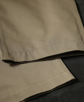 Tan chino trousers with cuffed hem and side seam stitching