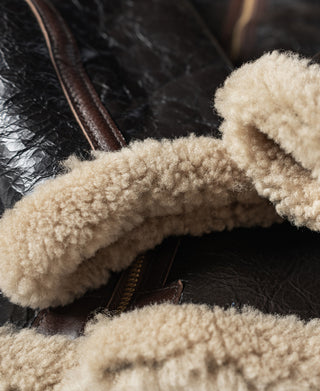 Dark brown flight jacket with cream shearling collar lining and zipper edge detail