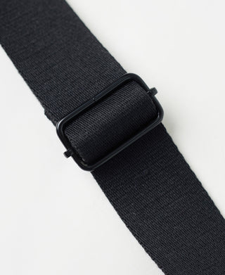 Black nylon helmet bag strap with metal buckle detail