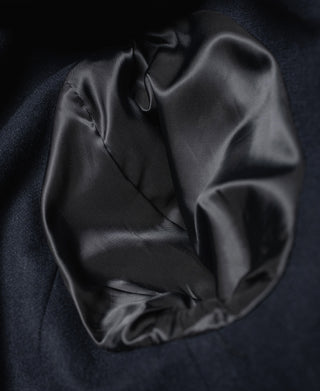 Black leather jacket lining with gathered fabric cuff