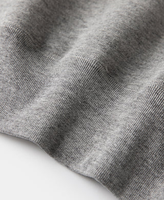 Gray knit sweater fabric close-up, fine heather texture