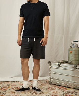 Black cotton crew-neck T-shirt with short sleeves and straight hem