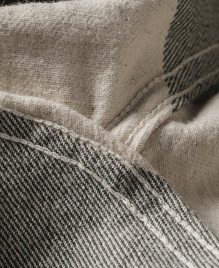 Prisoner pants corner seam detail on white and dark gray striped fabric