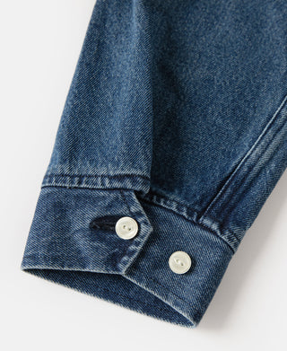 Indigo denim jacket sleeve cuff with two-button tab and folded hem