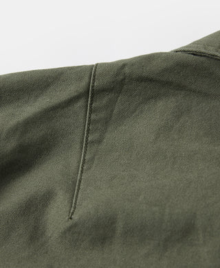 Olive fatigue utility shirt, back panel seam and stitching detail