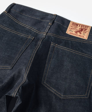 Indigo denim jeans with front patch label, coin pocket, and double-stitched seams