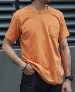 Orange slub cotton pocket t-shirt front view with short sleeves.