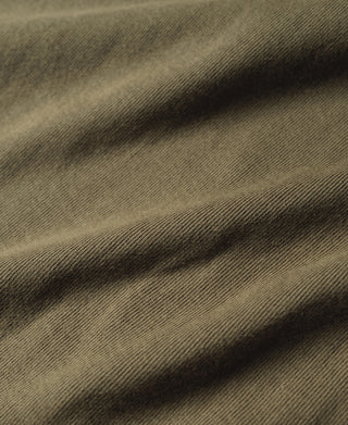 Olive cotton tank top fabric close-up, ribbed knit texture