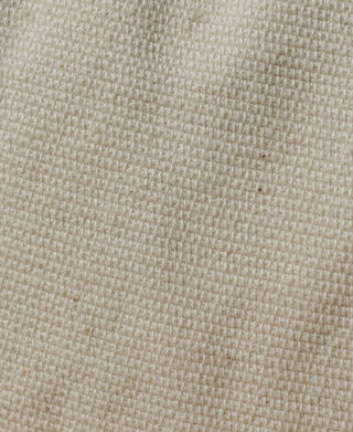 White dixie cup hat, close-up of woven canvas texture