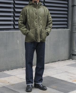 Olive quilted padded jacket with full-zip front, stand collar, and ribbed cuffs