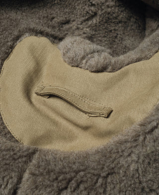 Khaki N-1 deck jacket inner collar with gray shearling trim and label