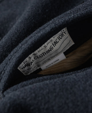 Navy peacoat inside collar label with text and Made in China tag