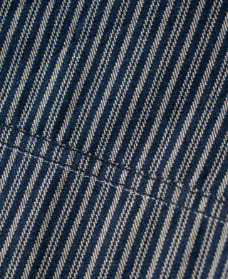 Striped cossack jacket fabric close-up with stitched hem detail