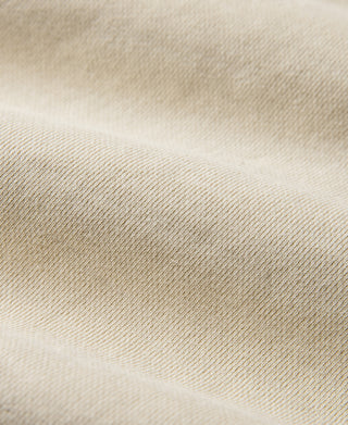 Apricot heavyweight knit fabric close-up with fine ribbed texture
