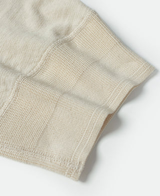 Cream knit cuff and stitched hem on short-sleeve henley