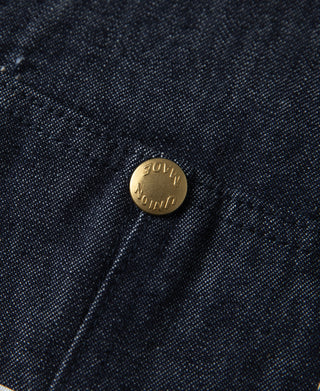 Indigo denim jacket gold snap button with engraved markings on seam