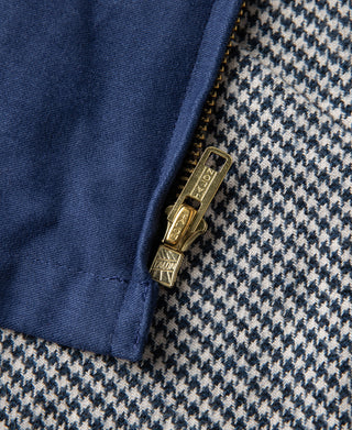 Blue cossack jacket lining with houndstooth pattern and brass zipper pull