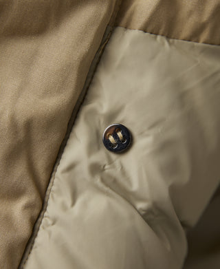 Khaki parka with dark button on inner front panel