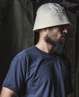 White dixie cup hat on person with short brim
