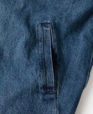 Stonewashed indigo denim work jacket interior seam tab with stitched outline