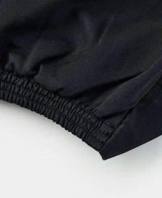 Black jacket hem with elastic waistband and gathered stitching detail