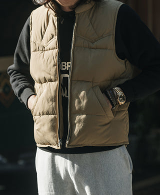 Khaki quilted padded vest with front zipper and side pocket openings