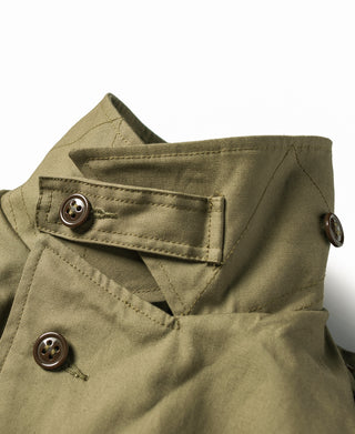 Olive field jacket with snap flap pockets and dark button closures