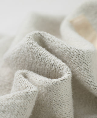 Fleece-lined hood detail on heather gray reverse weave sweatshirt