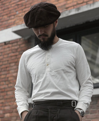 Long-sleeve henley shirt in white with button placket and stand collar
