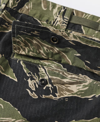 Tiger stripe camo fatigue pants pocket flap with metal snap button closure.