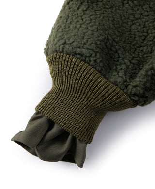 Olive jacket sleeve with ribbed knit cuff and folded fabric cuff