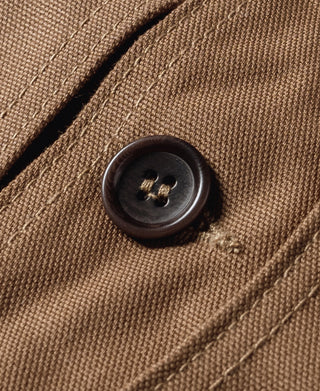 Khaki canvas hunting vest button detail on pocket flap