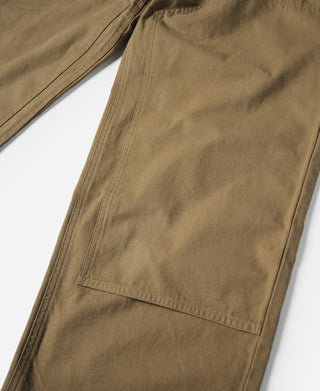 Khaki cotton canvas climbing pants with leg pocket, side view