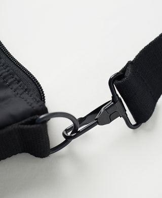 Black nylon helmet bag zipper with metal ring and strap connector