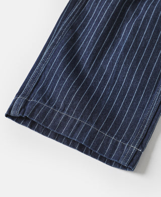 Indigo pinstriped work pants hem with folded cuff