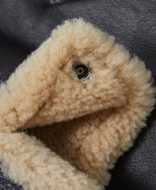 Shearling-lined inner pocket corner with tan fuzzy wool