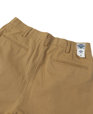 Tan chino trousers with belt loops, front pleats, and right side welt pocket