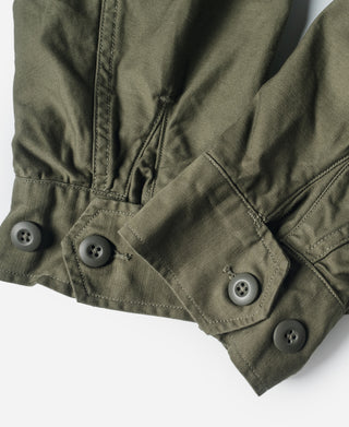 Olive field jacket sleeve cuff with four button closures