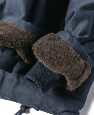 N-1 deck jacket sleeve cuff with brown shearling lining and rib-knit hem