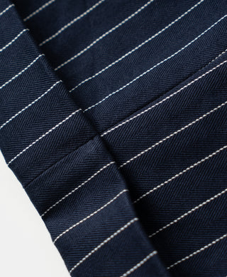 Navy pinstripe work pants with pleated front and contrast stitching