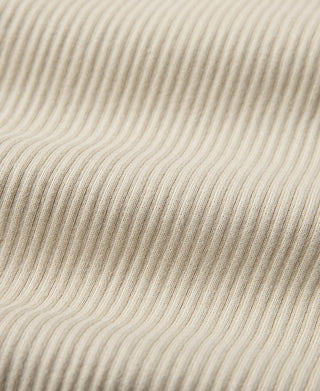 Apricot ribbed henley long-sleeve shirt, textured knit fabric close-up