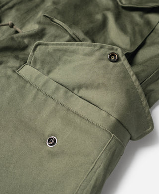 Olive field jacket flap pocket with metal snap and stitched seam lines
