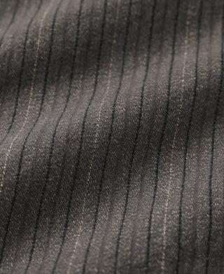 Brown pinstripe pants close-up showing vertical pinstripes and texture