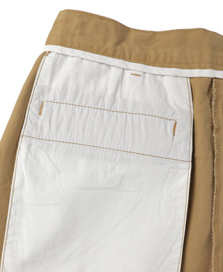 Tan chino trousers with waistband facing and interior buttoned pocket detail