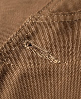 Khaki canvas hunting vest corner with contrast topstitching and bar tack