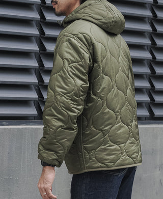 Olive quilted padded jacket side view with hood and full-zip closure