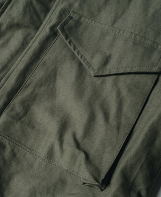 US Army M-65 field jacket, olive flap pocket with stitched edges and seam lines